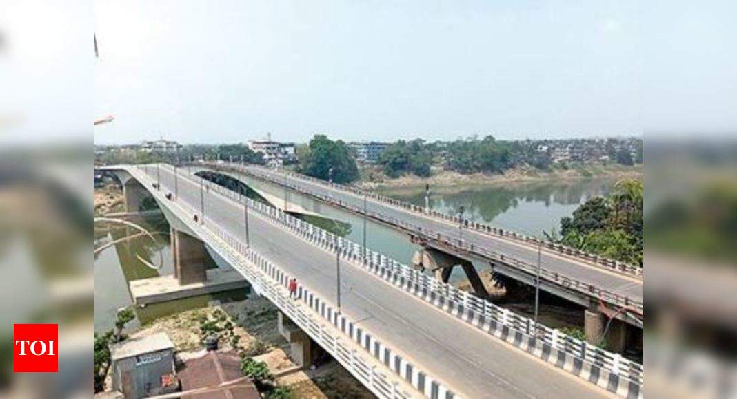 Assam: People out to get groceries maintain distance in Silchar ...