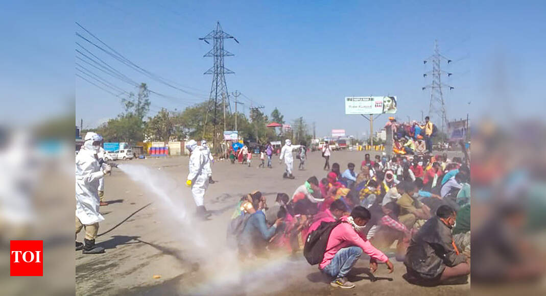 Row over spray of chemicals on migrants in UP