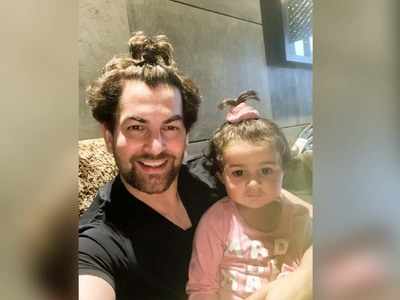 Neil Nitin Mukesh and 'awwdorable' photo with his daughter; captions, 'To convince her to make a ponytail, I had to make one first'