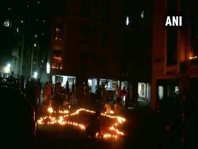 Millions of Indians respond to PM Modi's appeal; light candles, diyas, turn on mobile phone torches