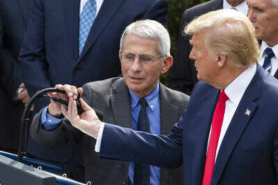Trump says he is on same page with Fauci, not firing him