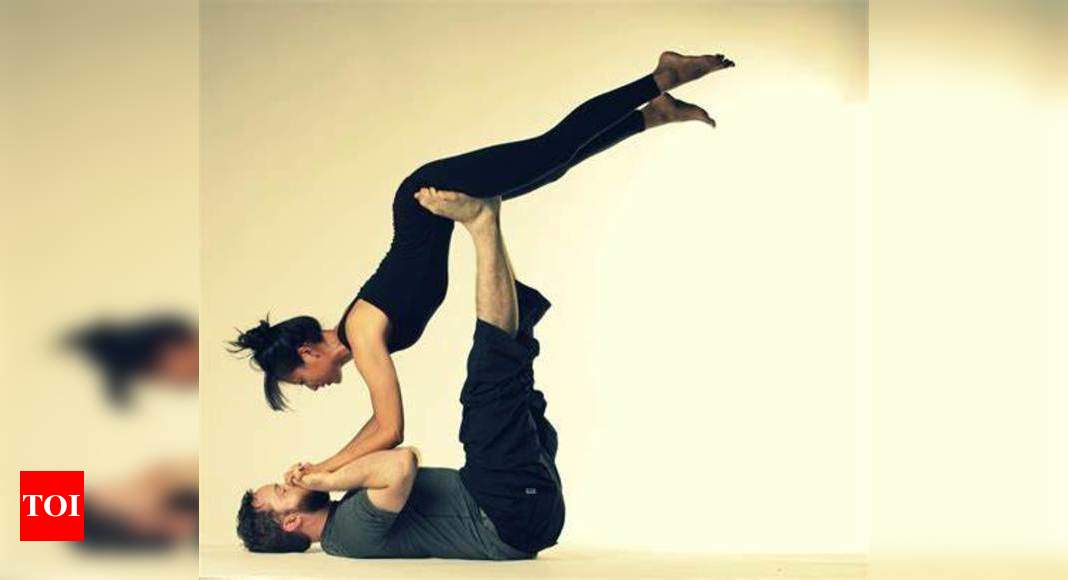 6 Couple Yoga Poses to Help You Bond With Your Partner