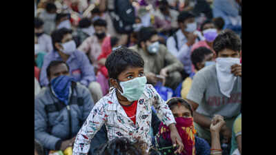 Covid-19 lockdown: Migrant workers in Punjab wait for transport to ...