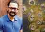 Did Aamir distribute money in flour packets?