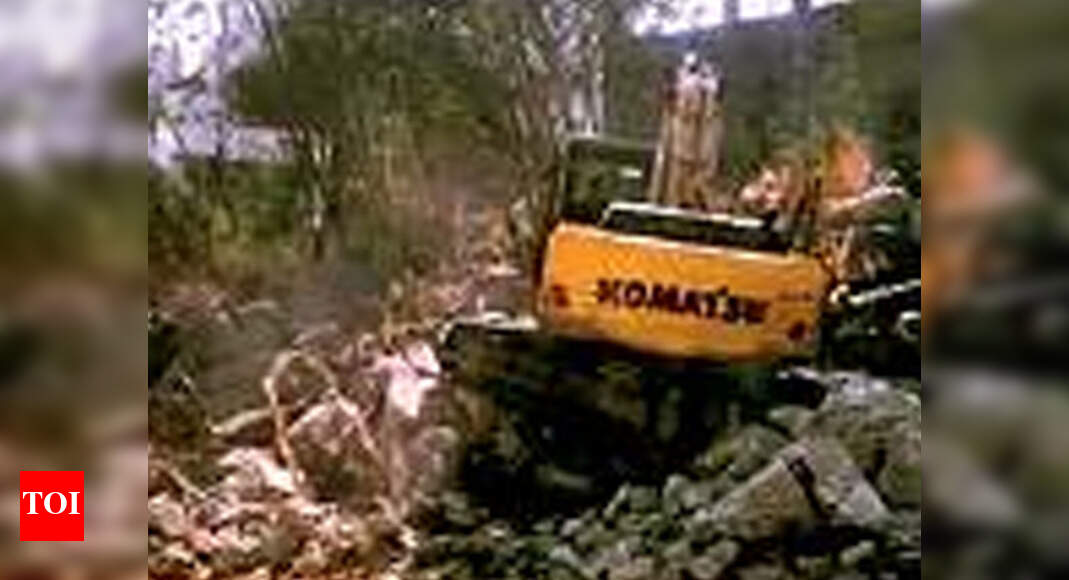 Now, boulders dumped in HUDA park area | Hyderabad News - Times of India