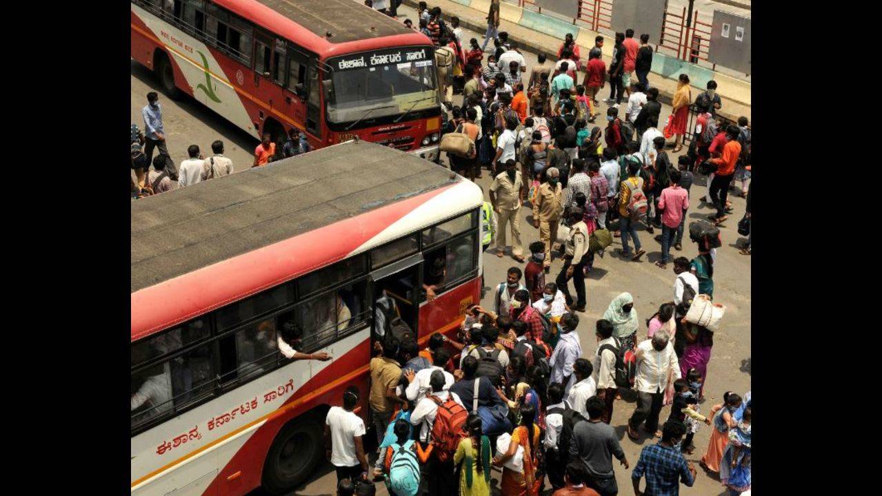 Bengaluru: Free transport brings cheer to migrant workers at Majestic bus  terminus | Bengaluru News - Times of India