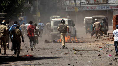 Surat: Agitated migrant workers clash with cops, pelt stones