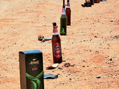 In Gannavaram, tipplers turned innovative and left empty bottles as their proxy in the queue outside a liquor store on Tuesday Liquor sale in Andhra Pradesh: Hic! Tipplers complain that in two days liquor becomes 75% more expensive in Andhra Pradesh | Amaravati News