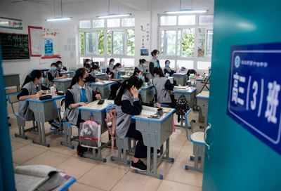 Students in China's virus centre Wuhan return to school
