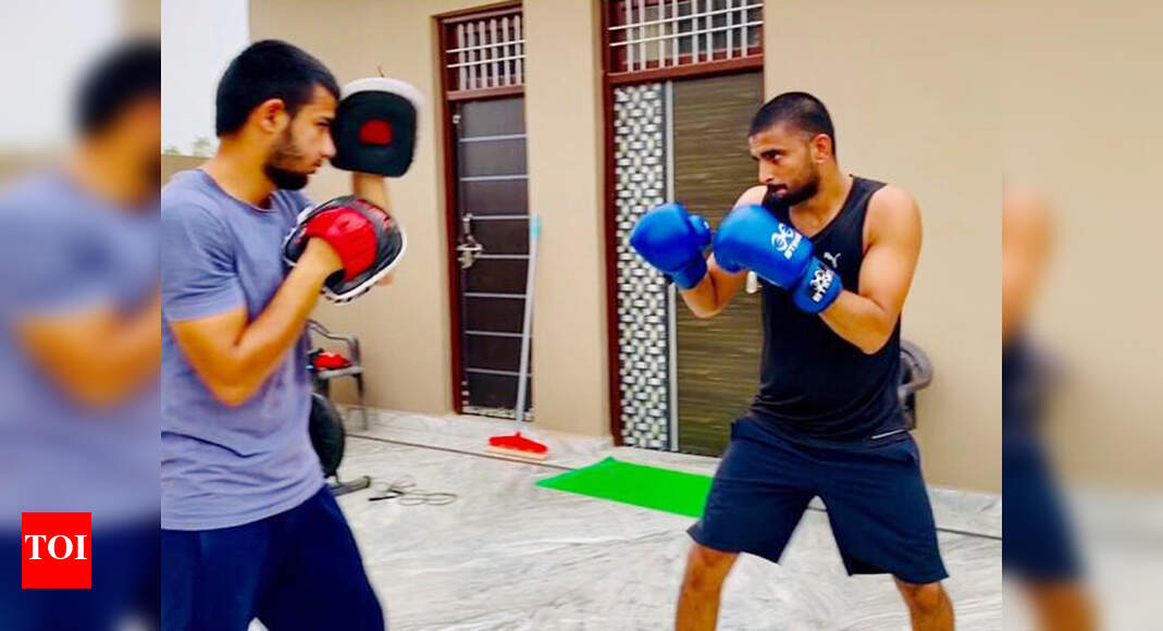 Olympic-bound boxer Manish Kaushik sparring at home with his brother ...