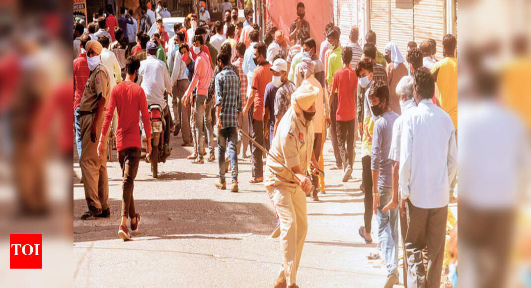 Ration queue swells, cops resort to lathicharge in Ludhiana | Ludhiana ...