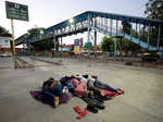 In pics: Stranded migrant workers desperate to return home