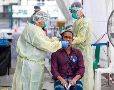 Singapore reports 451 new coronavirus cases