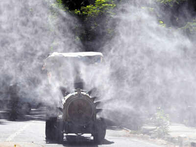 B M C workers along with Mumbai Fire brigade sanitize the area by spraying sodium hypo-chloride mixed with water from at Mulund one positive was found in Mumbai on Tuesday