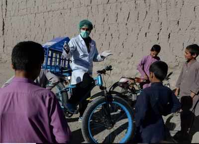 Afghan cyclist in 'door-to-door' campaign to curb coronavirus