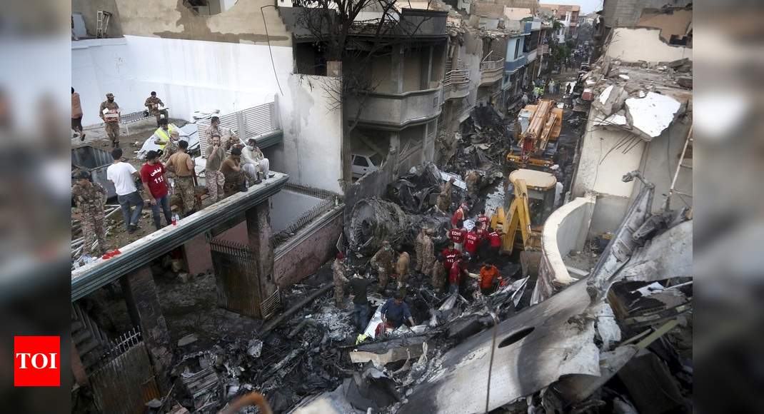 Dozens die as Pakistan airliner with 99 on board crashes into crowded Karachi area
