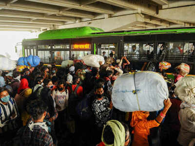<p>Stranded migrants board a bus at Gazipur to travel to their native places on Delhi-Uttar Pradesh border. (PTI photo)<br></p>
