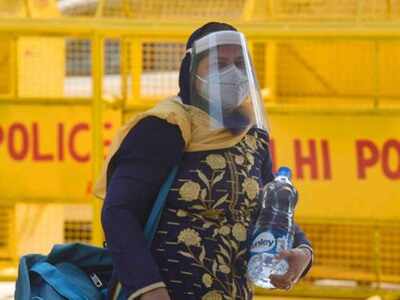 A passenger wearing a face shield outside New Delhi railway station during ongoing Covid-19 lockdown on Saturday.