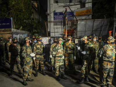 Army personnel deployed to clean roads following the landfall of cyclone Amphan, in Kolkata . Thousands took to the streets on May 23 to protest against what they said was the slow government response to power cuts and flooding. (AFP photo)