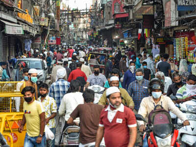 Muslims visit a market to shop on the eve of Eid-ul-Fitr during the ongoing Covid-19 lockdown near Jama Masjid in Old Delhi on Sunday. (PTI)