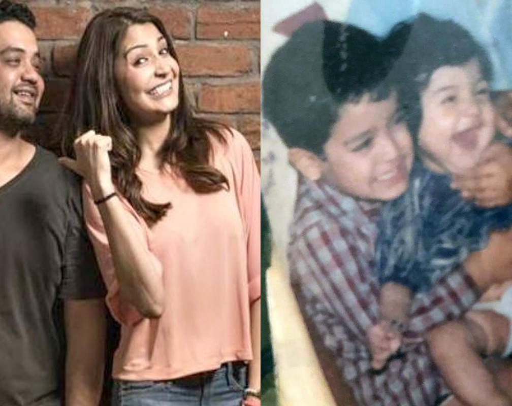 
Anushka Sharma looks adorable sitting in her brother Karnesh Sharma's lap in this throwback childhood picture

