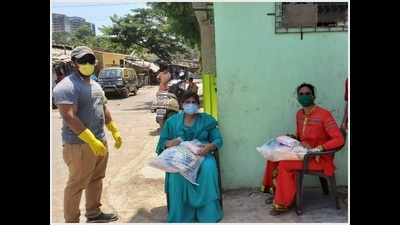 Indian Territorial Army officers distribute ration and hygiene kits in Mumbai