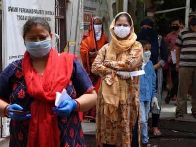 FILE: People with coronavirus symptoms wait in queue for a COVID-19 test at an ayurvedic hospital during a lockdown imposed as a preventive measure against the spread of the COVID-19 coronavirus in New Delhi. AFP