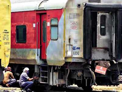 Workers carry out maintenance at the Basin Bridge train care centre