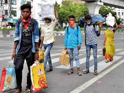 Migrant workers seen walking to their home towns to Madhya Pradesh from Hyderabad on Sunday