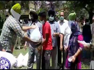 Trust members distribute ration to the needy in Patiala.