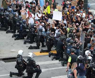 Police Stun Americans By Taking A Knee With Protesters Times Of India