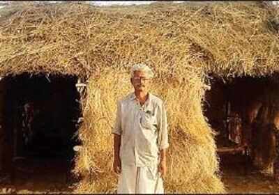 A man outside a hut at a village in Sheo area of Barmer district