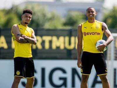 Dortmund's Sancho, Akanji fined for defying virus controls for haircuts