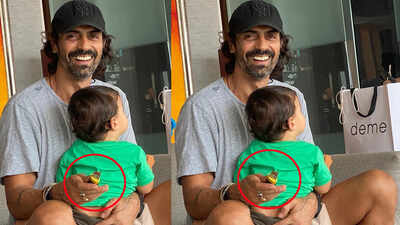 ‘Hope you calmer now’, writes Arjun Rampal after Instagram user asks him why he has a knife in his hand while carrying baby Arik