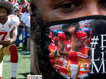 Pictures of African American NFL star Colin Kaepernick, who protested against police brutality four years ago