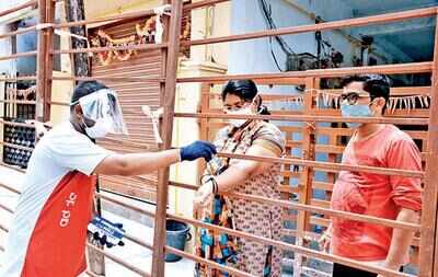 A resident is stamped at a containment zone in Swarna Bharati Colony in New Bowenpally in Secunderabad on Monday