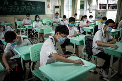 Beijing imposes partial travel ban, closes schools over virus outbreak