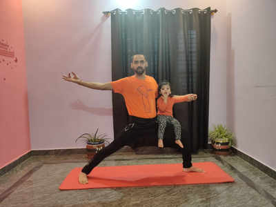 Mixing health with fun, fathers and children are bonding over yoga