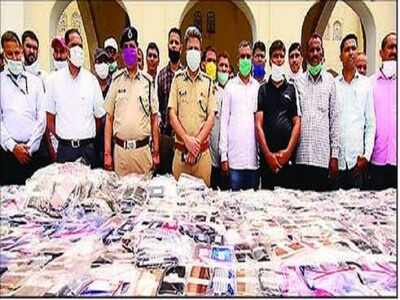 Police commissioner Anand Srivastava with recovered cell phones