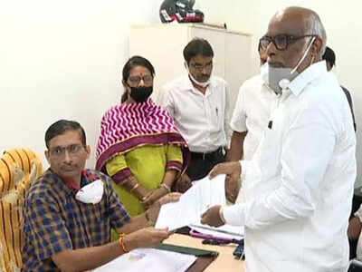 Senior YSRC leader Dokka Manikyavaraprasad (extreme right) files his papers for by-election in the council.