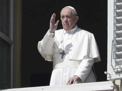 Pope Francis delivers his blessing from the window of his private library overlooking St. Peter's Square, at the Vatican. (AP Photo)