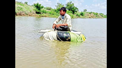 Gujarat: Road under 10 feet water, farmers use makeshift boats to reach fields