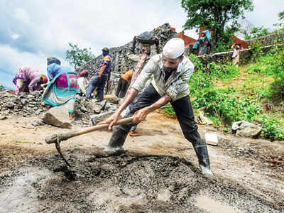 Ashok Dhokale, back in his native Mulshi, works at a construction site