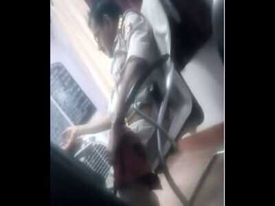 Screegrab of the video, cop can be seen sitting on chair.