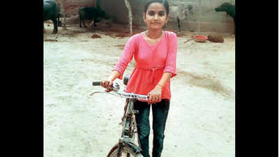 TOI daily: Village girl who cycles 24km to school & back gets 98.5%