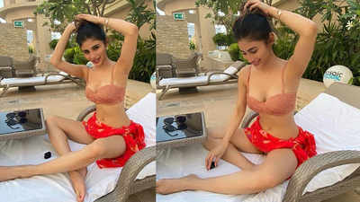 Mouni Roy enjoys sunbathing by the pool looking flawless in a polka dot bikini in these new pics