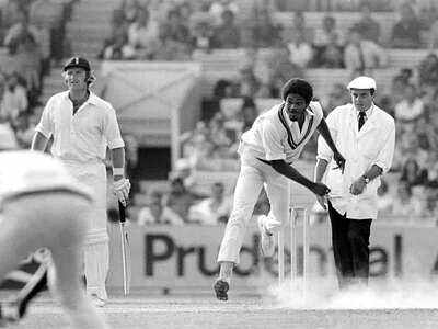 Michael Holding bowling for West Indies during the 5th Test match between England and West Indies at The Oval, London, 13th August 1976. Dennis Amiss is the England batsman backing up and Dickie Bird the umpire. (Photo by Patrick Eagar/Popperfoto via Getty Images)