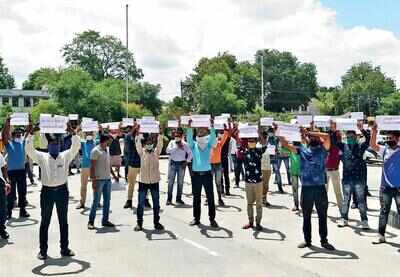 Retired and in-service defense personnel protesting outside the office of superintendent of police in Chhota Udepur