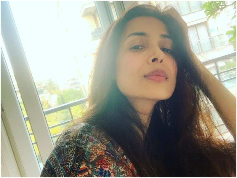 Malaika Arora shares an age-old mantra for shiny hair - Times of India