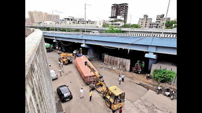 Photos: Container falls 40 ft from bridge in Thane, driver killed